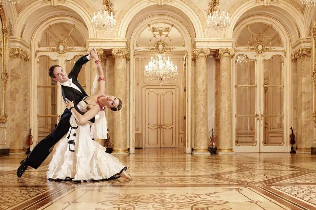 A dancing couple in a Viennese ballroom.
